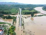 Повінь у Китаї - тропічний шторм спричинив масштабні руйнування - фото 14