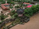 Повінь у Китаї - тропічний шторм спричинив масштабні руйнування - фото 10