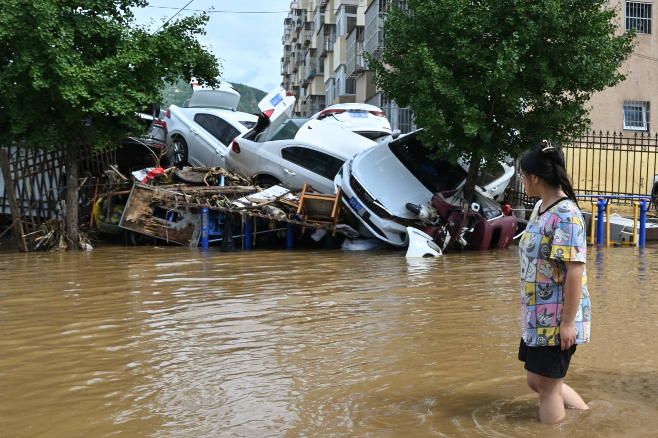 Повінь у Китаї - тропічний шторм спричинив масштабні руйнування - фото 16