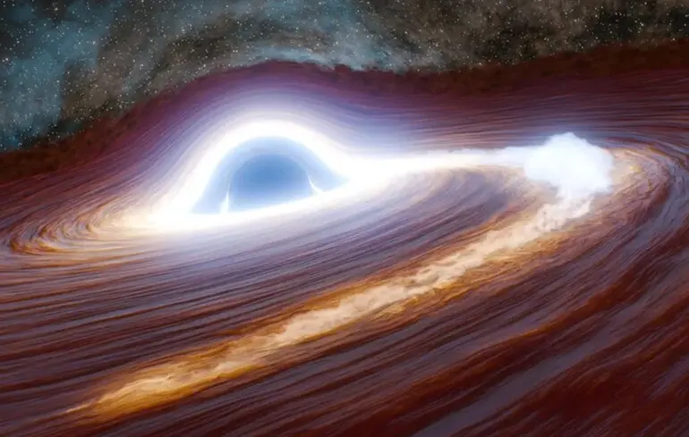 Учені зареєстрували рекордний викид речовини - чорна діра роздирає гігантську зірку 1