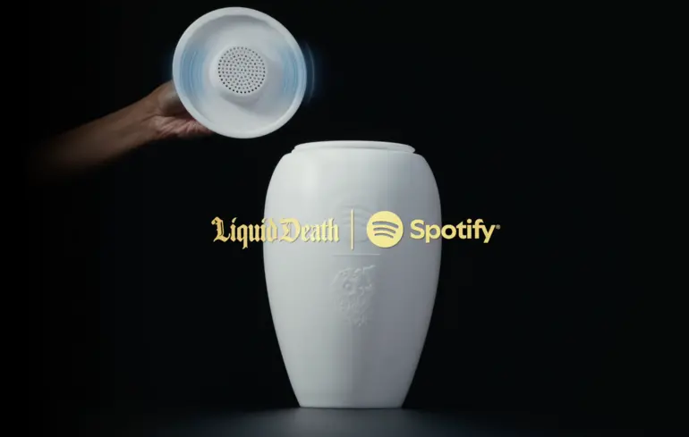 Bluetooth-колонка, виконана у формі поховальної урни, стала результатом співпраці Spotify та Liquid Death, які представили Eternal Playlist Urn. 1